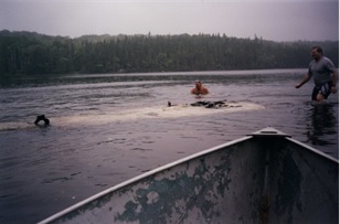 Photograph of Roy Marryatt and Marcus McLaren in the water with wing