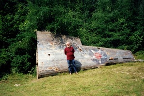 Photograph Irving Allen standing in front of wing in Robert Walsh's yard - 2000
