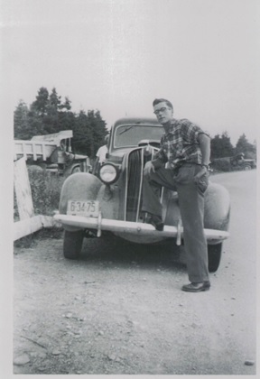 Photograph archives of Leslie Ryter with permission – a younger Leslie Ryter with his first car a 1936 Plymouth (Circa 1953)